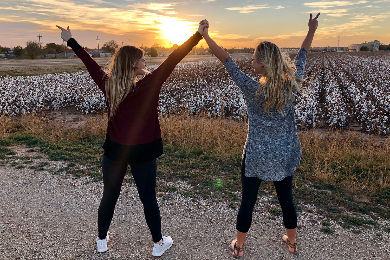 Brooke and Lauren in front of a cotton field